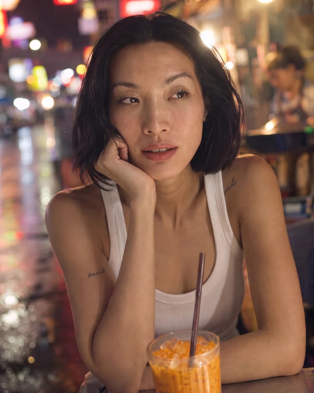 AI-generated portrait of Piya at a Bangkok night market, chin resting on her hand over an iced drink, neon signs and street lights behind her