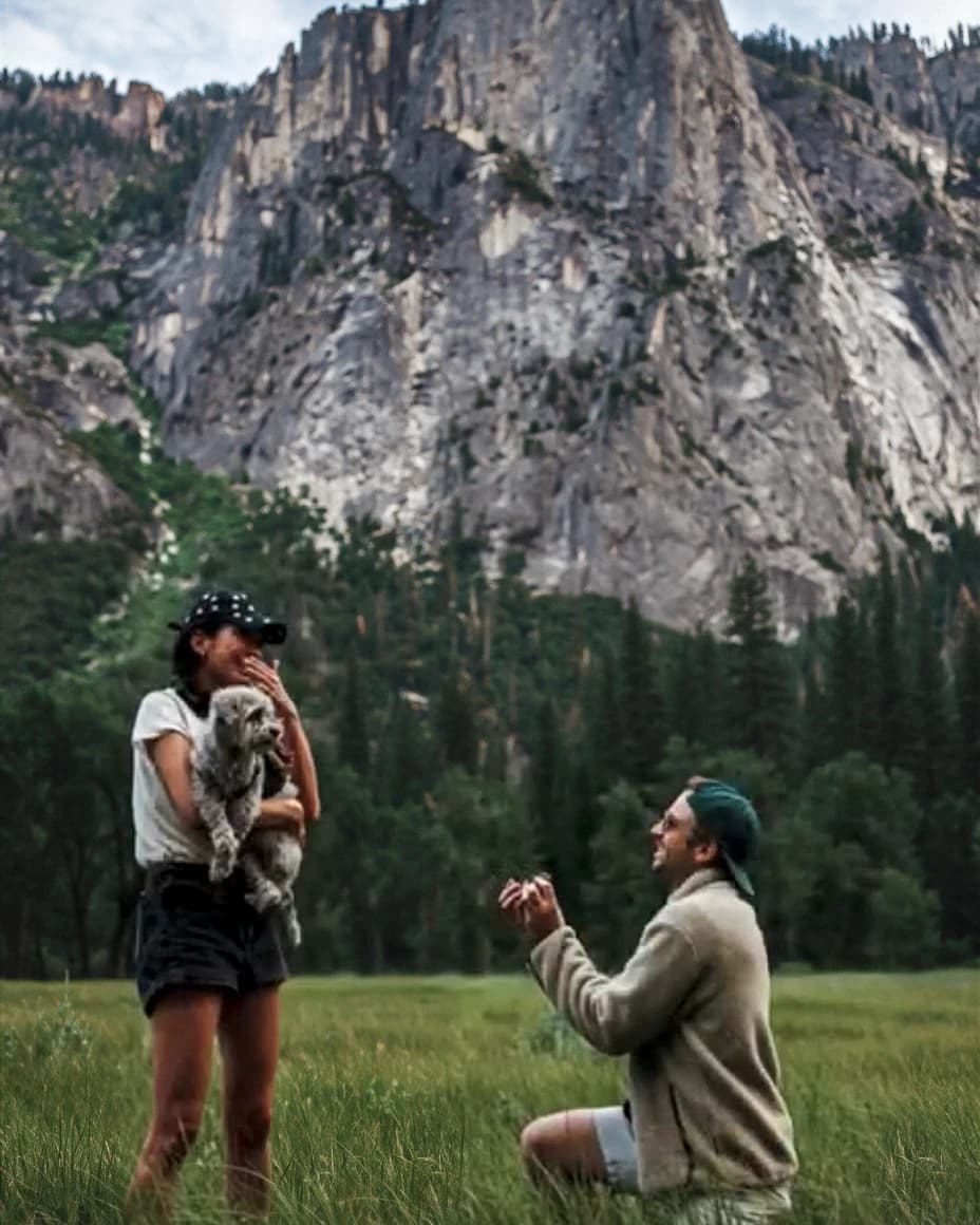 The founders' real Yosemite proposal photograph — Piya holding the real Dexter — with the background rebuilt by AI