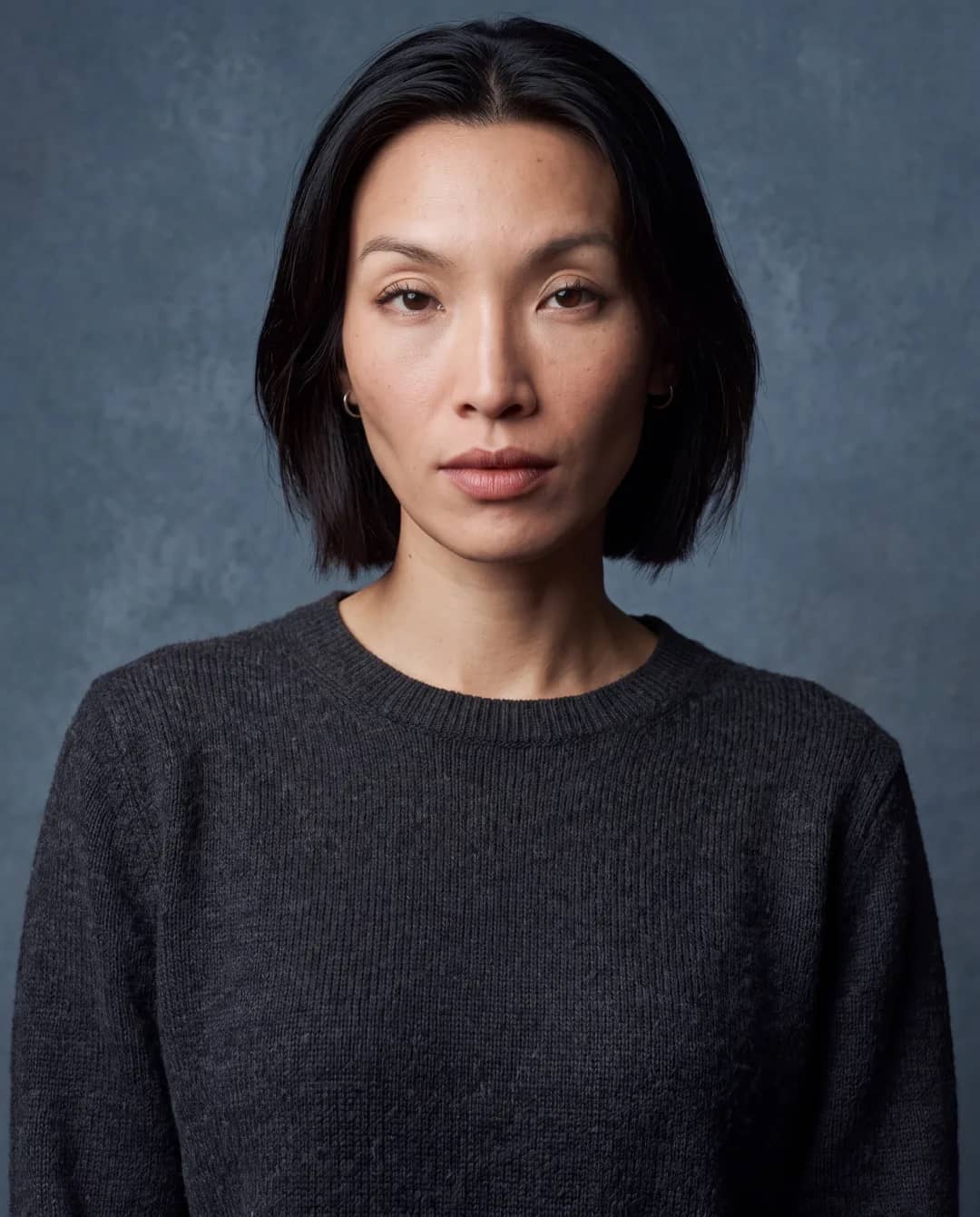 AI-generated First Look frame of Promptography cofounder Gift: a chest-up studio portrait